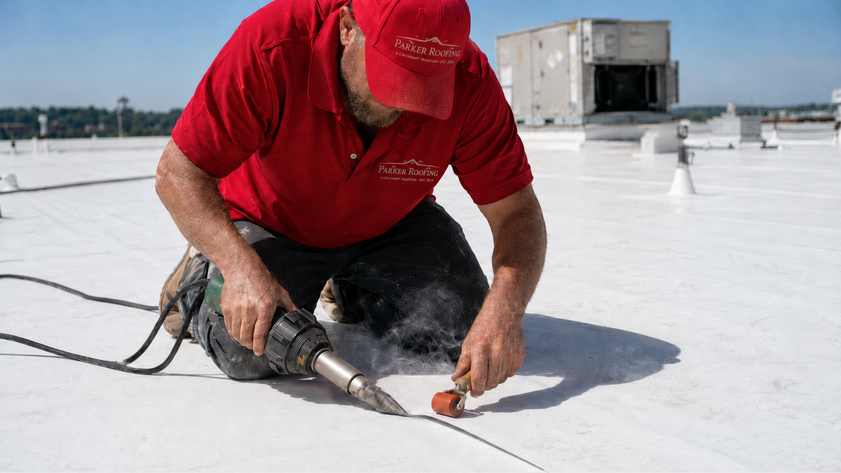 Parker Roofing crew installing a commercial flat roof in Cincinnati, OH